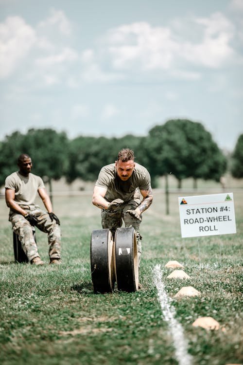 A Soldier Rolling a Wheel