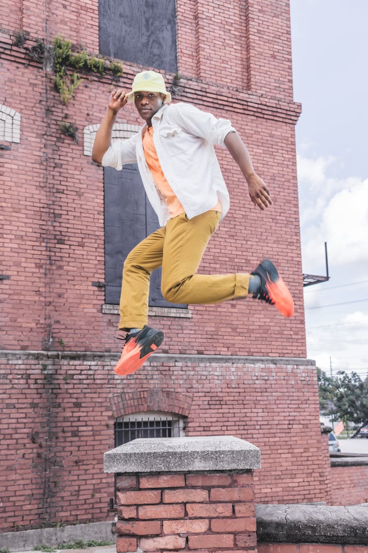 A Man Jumping And Posing In The Air 