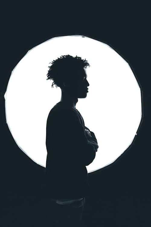 A Silhouette of a Man with Curly Hair