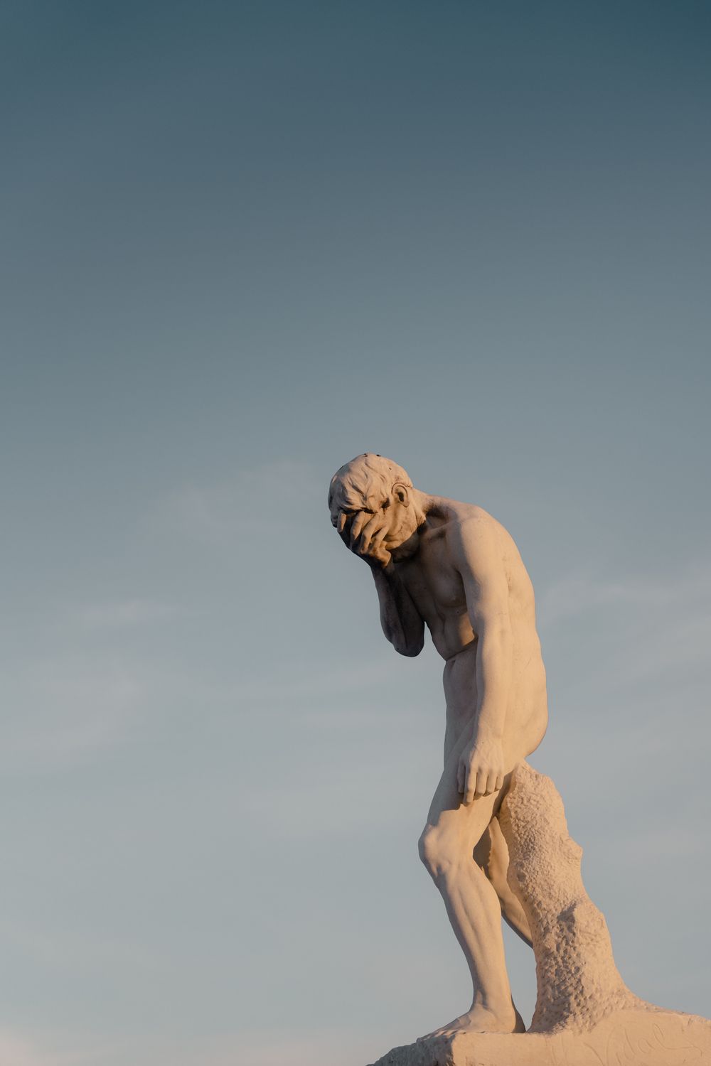 Brown Concrete Statue Under the Blue Sky · Free Stock Photo