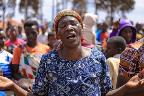Free A woman passionately worshipping during a religious gathering in Ngozi, Burundi. Stock Photo