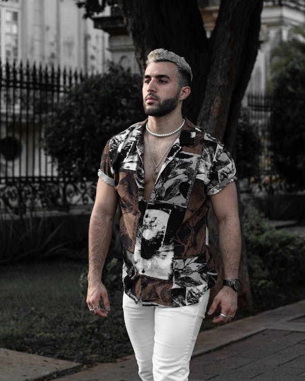 Photo of Man in a Dress Shirt walking on Pavement · Free Stock Photo