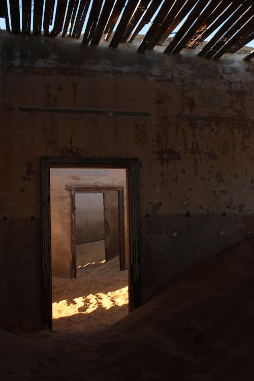 Interior of an Abandoned Building with Sand on the Floor 