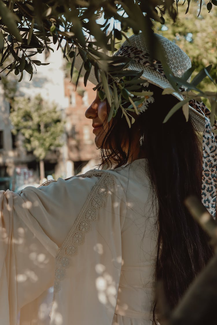 Woman In Summer Hat Near Tree