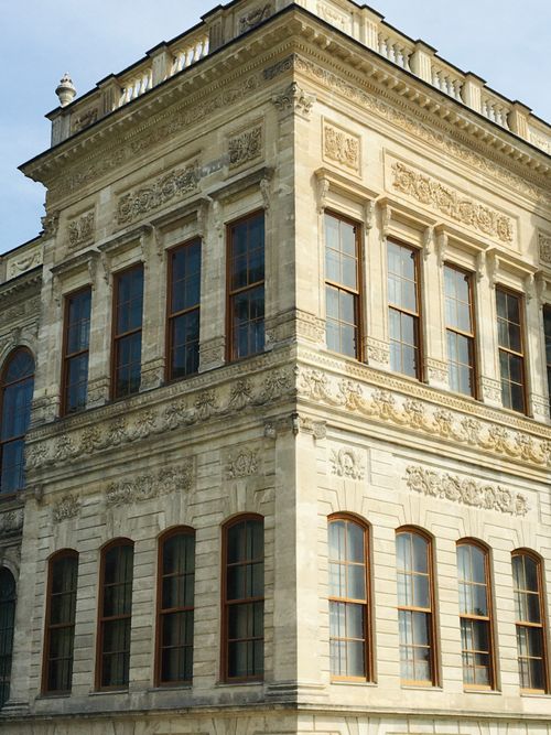 Free Detailed view of a neoclassical building facade with ornate design elements. Stock Photo
