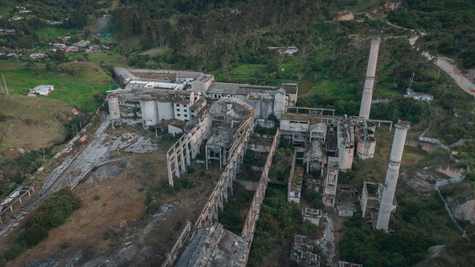 Best The Best Private Tour to Guatapé and Helicopter Ride + Guatapé's Rock + Boat Ride Review 2026 - An aerial view of a ruined factory amidst lush greenery in Bogotá, Colombia.