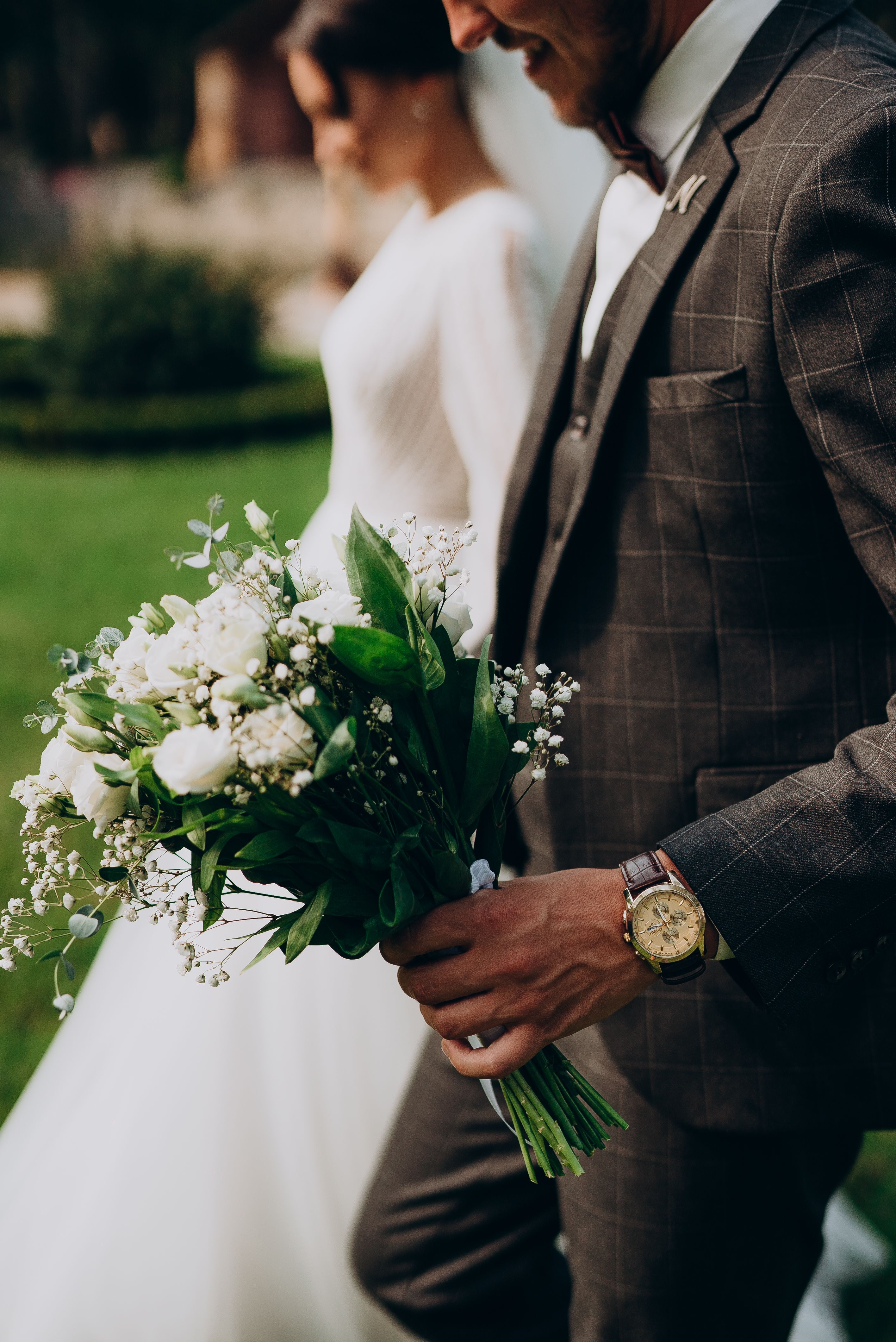 A Man Holding Bouquet of Flowers · Free Stock Photo