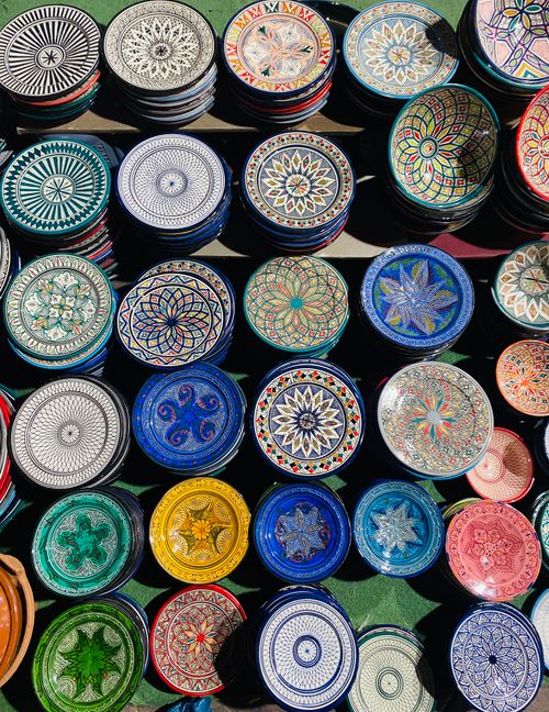 Free Colorful handmade Moroccan ceramic plates with Oriental patterns on display in Marrakech market. Stock Photo