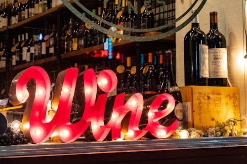 Free Red Wine Marquee Signage on Table Stock Photo