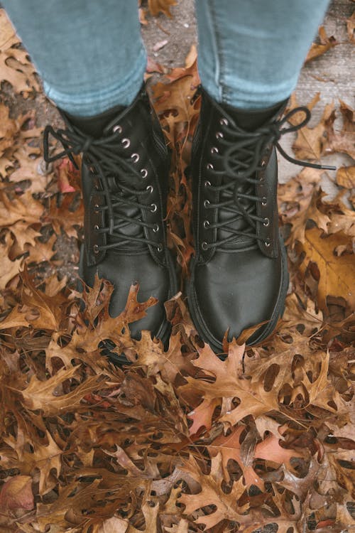 A Person Stepping on a Fallen Leaves