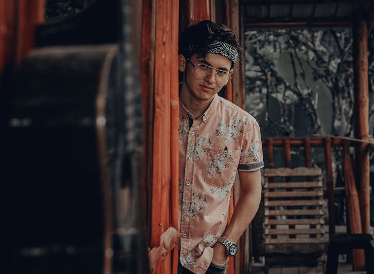 Man With A Bandana Standing On A Doorway