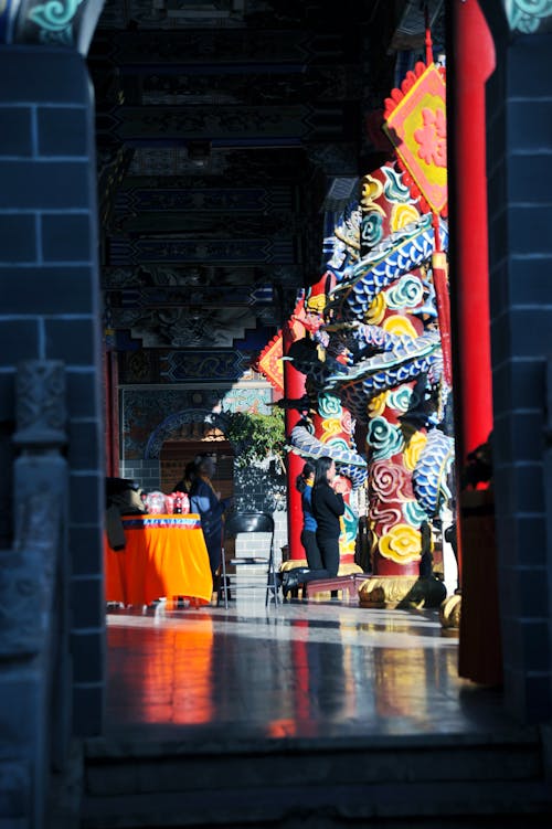 People Praying in Traditional Temple