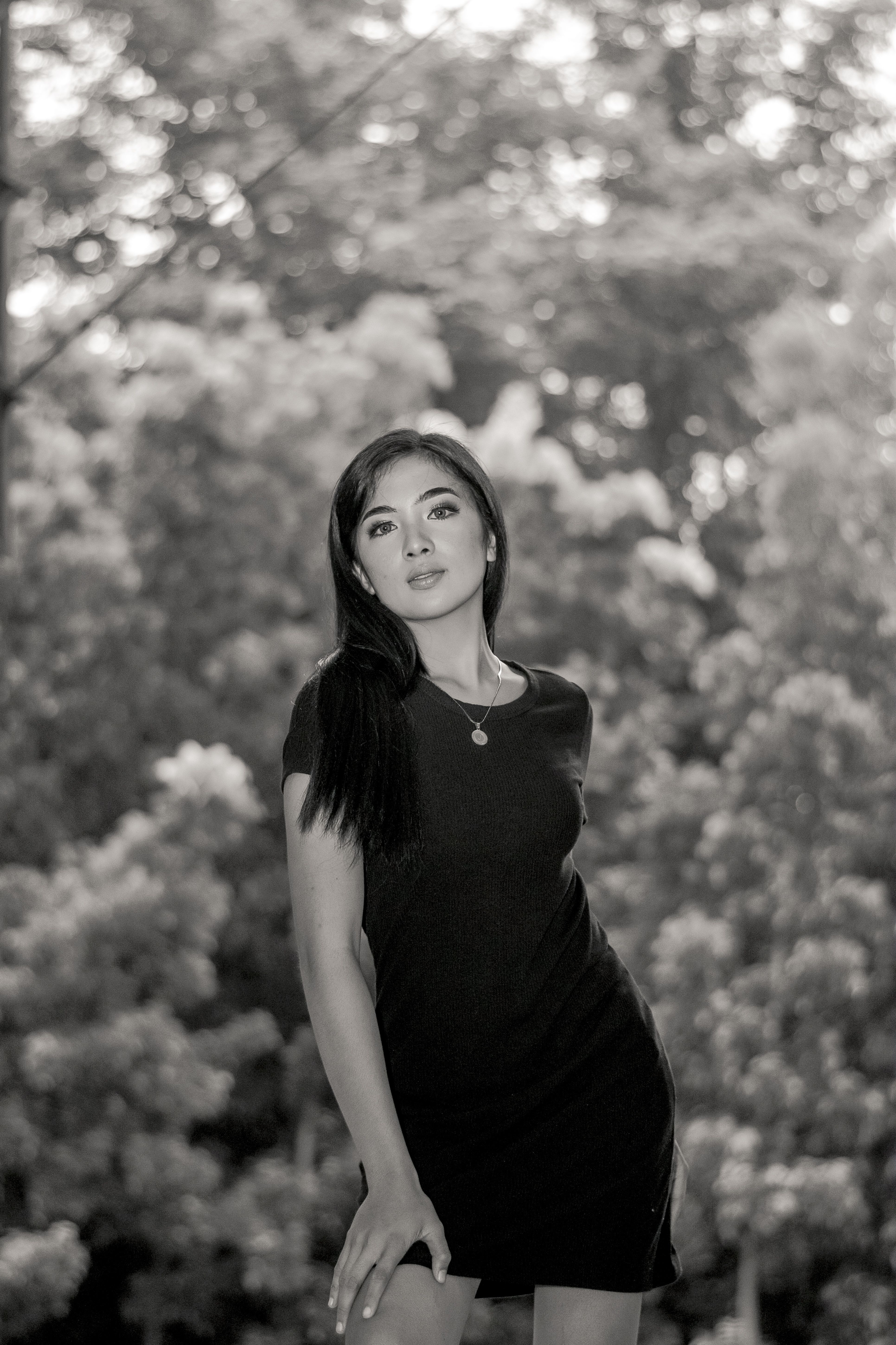 Grayscale Photo of a Woman in a Black Dress · Free Stock Photo