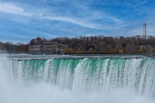 Stunning view of Niagara Falls with autumn foliage, showcasing natural beauty and power.