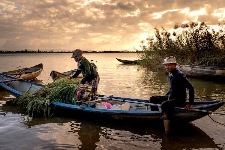 Man And Woman Riding On Rowboat