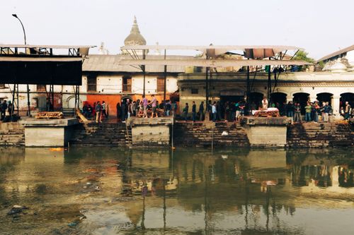 Free People gather at Pashupatinath Temple in Kathmandu, Nepal for a Hindu ritual by the river. Stock Photo