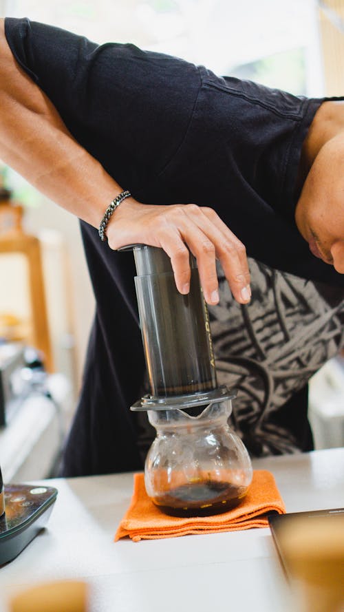 A Barista Making Brewed Coffee