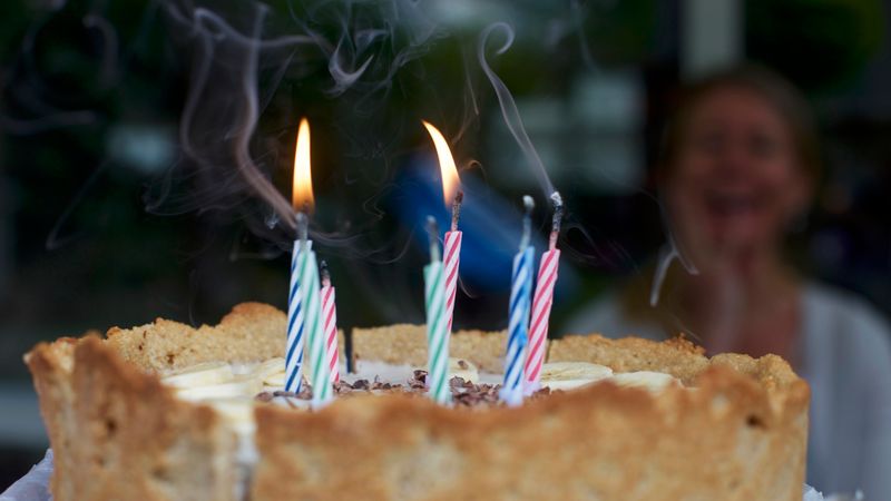 Birthday cake with lit candles