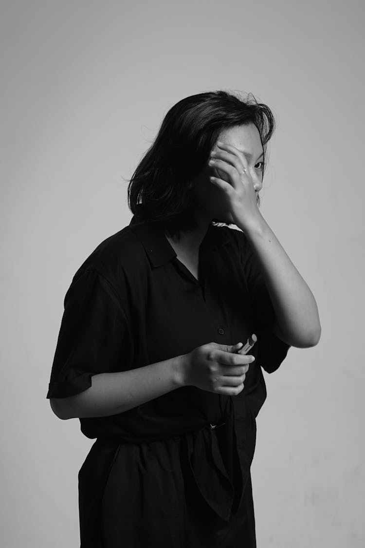 Grayscale Photo Of Woman Holding A Lipstick 