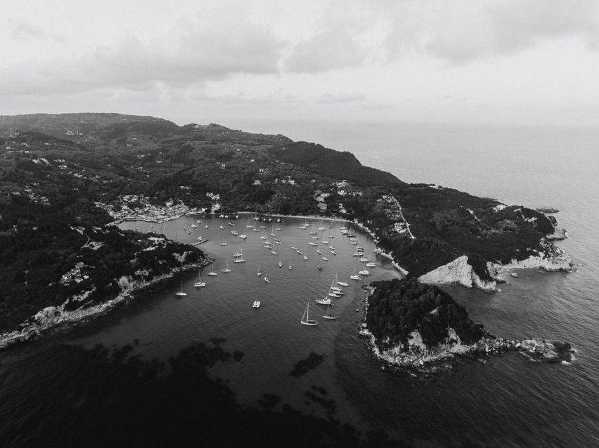 Unbeatable 5 hours from Kassandra: W Sithonia Coves & Islands Yacht Sailing Review 2026 - Black and white aerial shot of sailboats in a coastal bay in Greece, surrounded by lush landscapes.