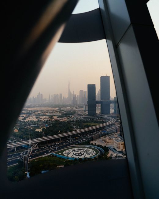 View of Dubai's modern skyline featuring iconic landmarks like the Burj Khalifa at twilight.