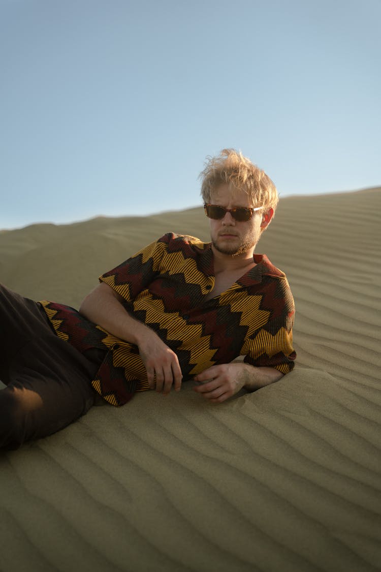 Man Lying Down On Desert