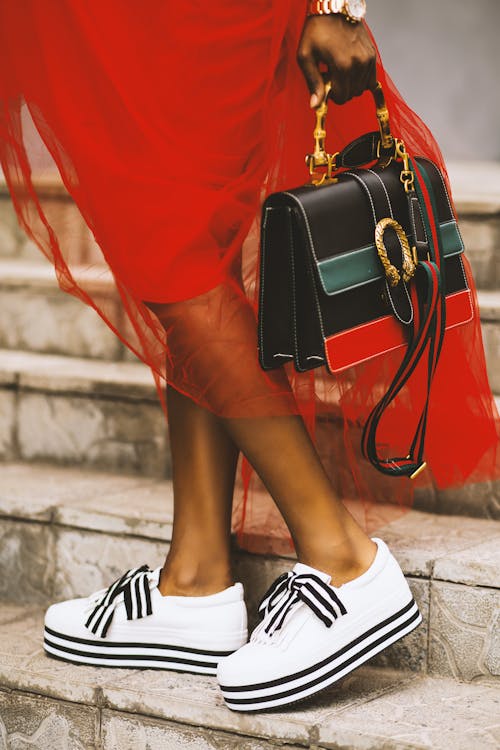 brands greenpeace Free Person Carrying Black Leather Handbag Stock Photo