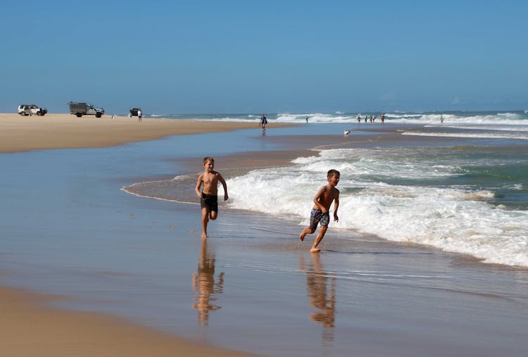 Kids Running On Beach