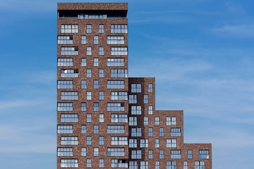 Brown Concrete Buildings Under the Blue Sky