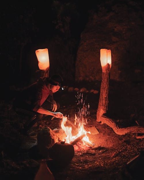 Man Sitting by Campfire
