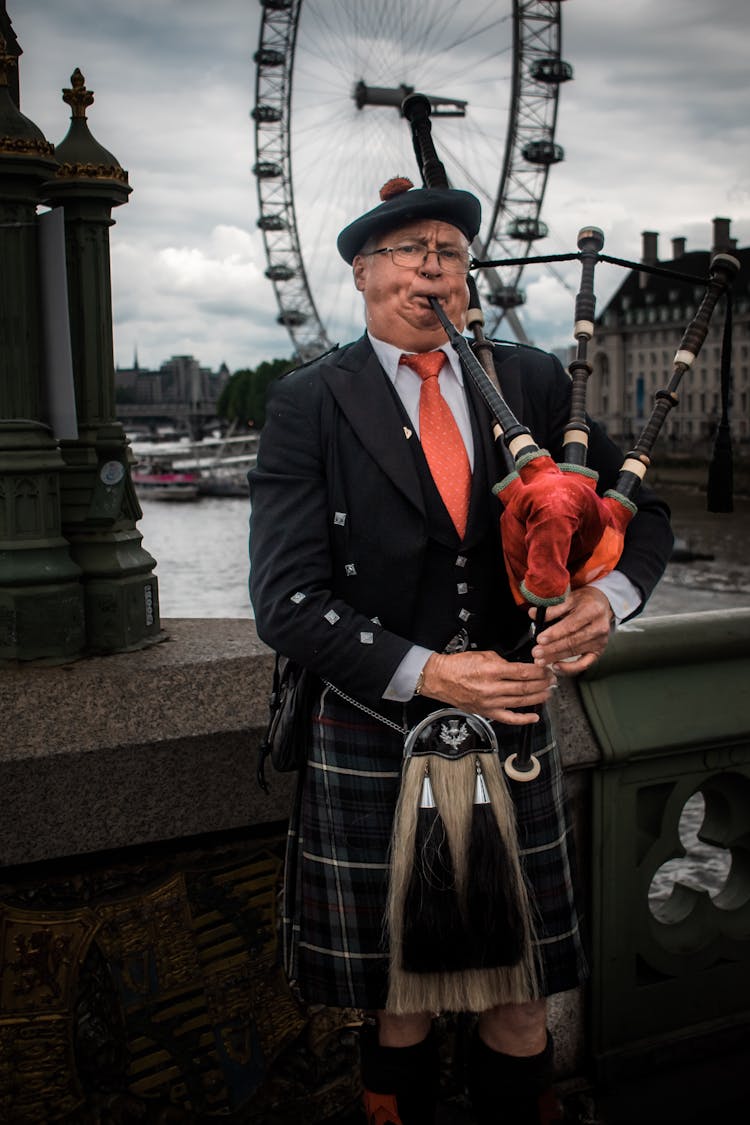 Scottish Man Playing Bagpipes In London 