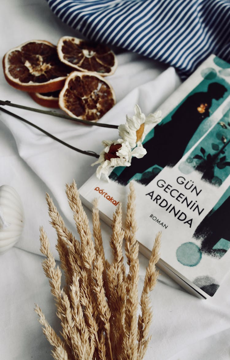 Book, Flowers And Orange Slices