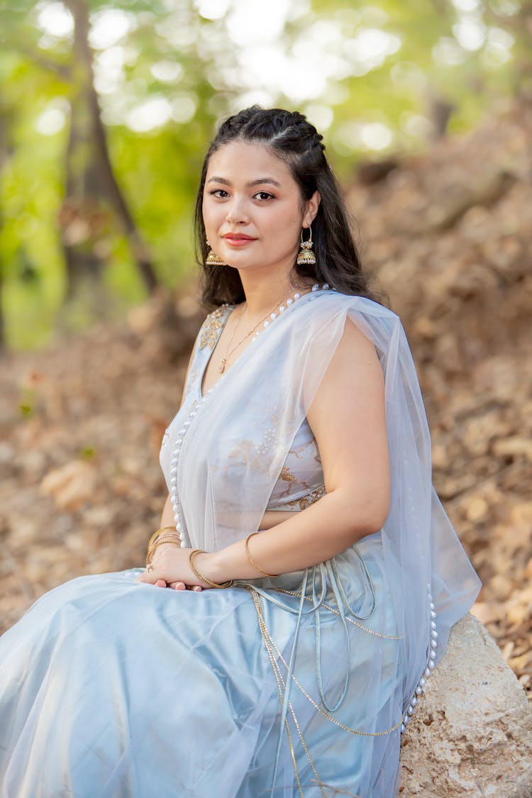 Woman In Dress Sitting