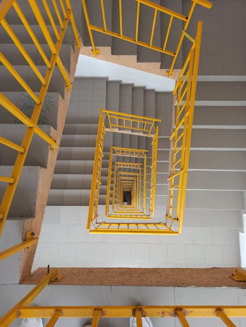 Yellow and White Spiral Staircase