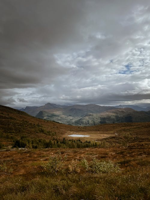 Hills Under the Cloudy Sky 