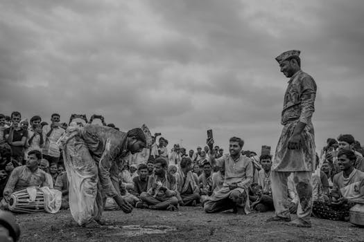 A captivating black and white image capturing a traditional ceremony with a large crowd in Pandharpur, India.