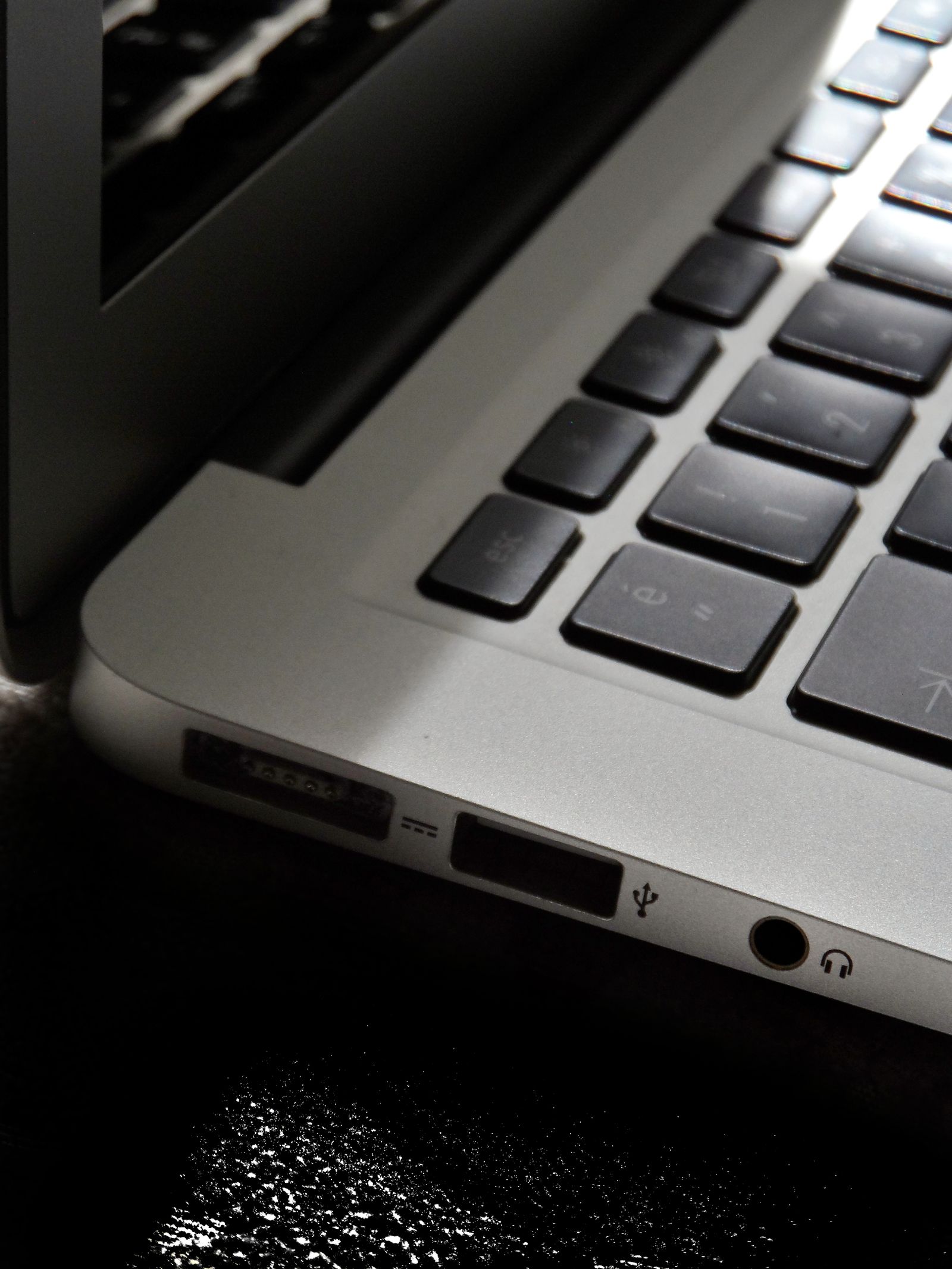Close view of a laptop keyboard and connection ports
