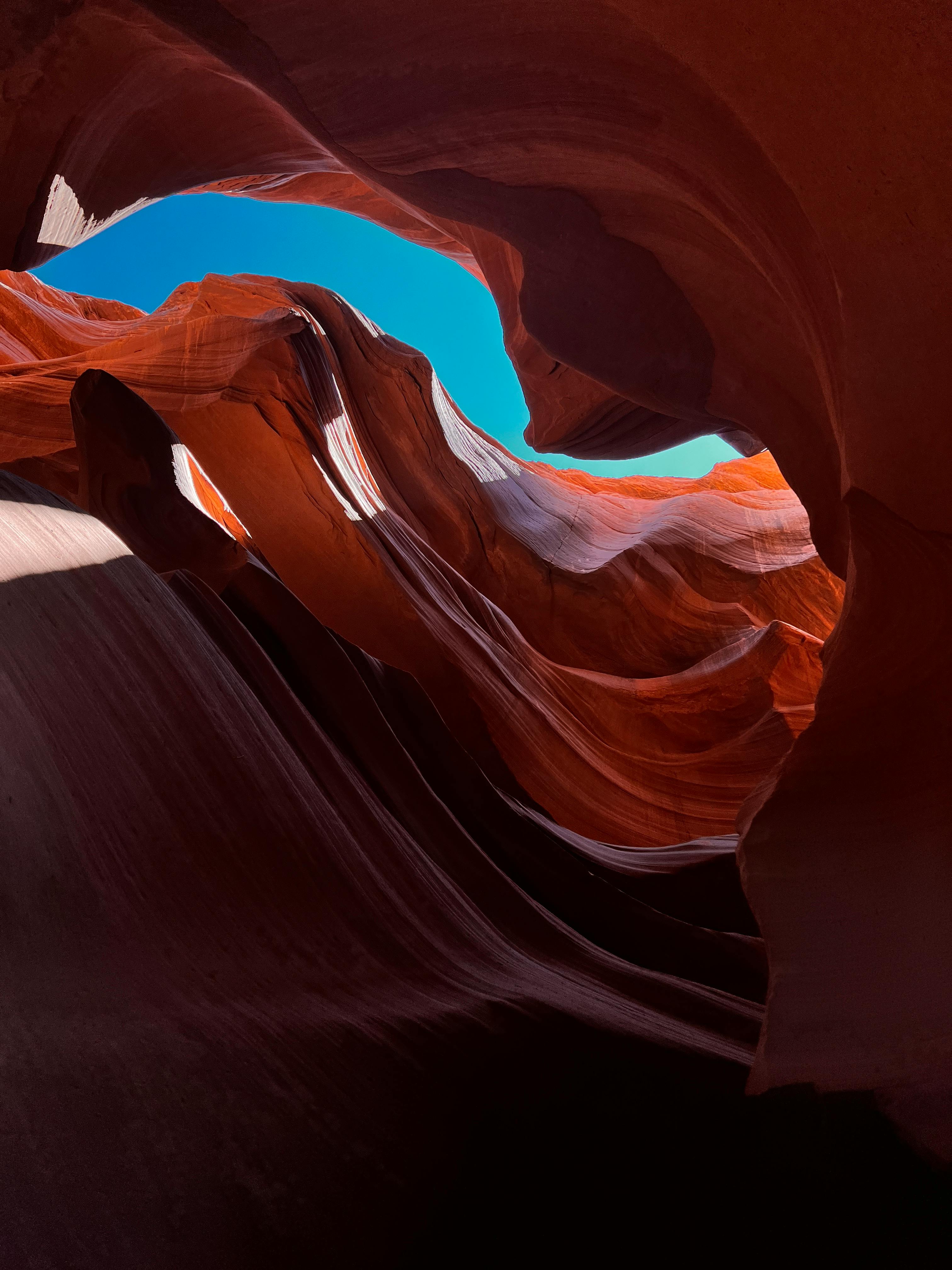 low angle shot of antelope canyon under the blue sky