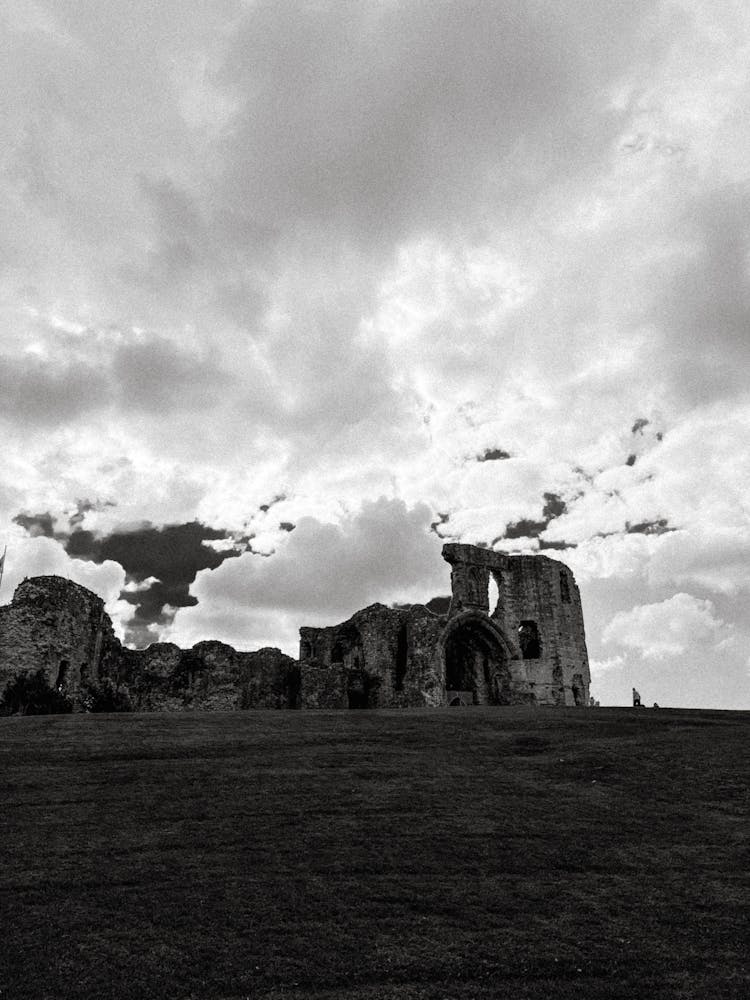 Grayscale Photo Of The Ruins Of Denbigh Castle In Denbigh, Wales, United Kingdom