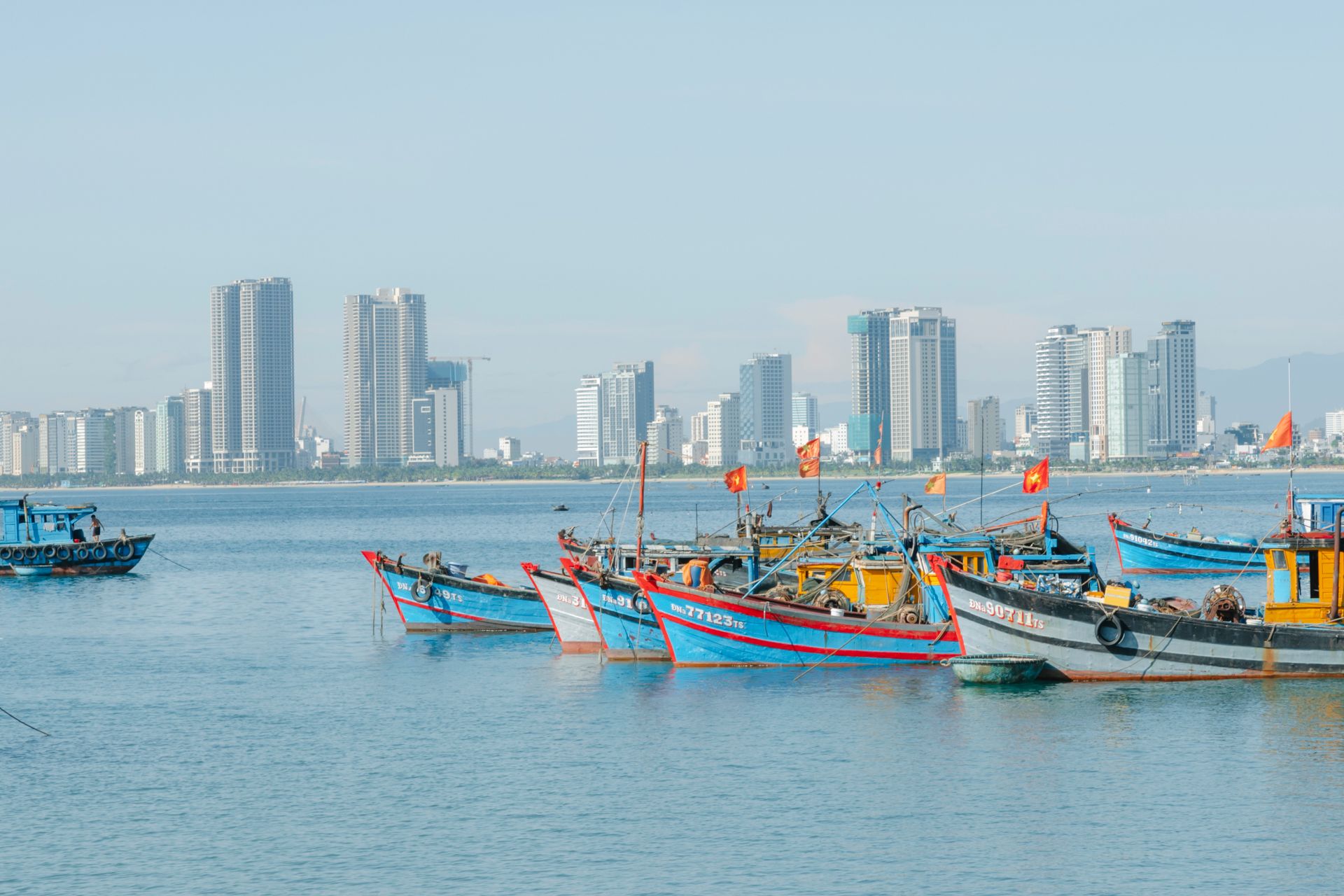 Boats Sailing on the Sea Near the City Buildings