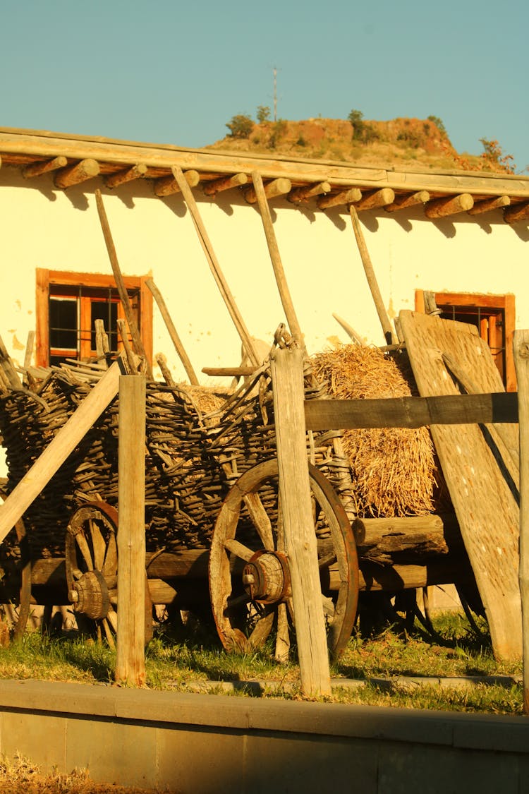 Rustic House With Vintage Wooden Wagon