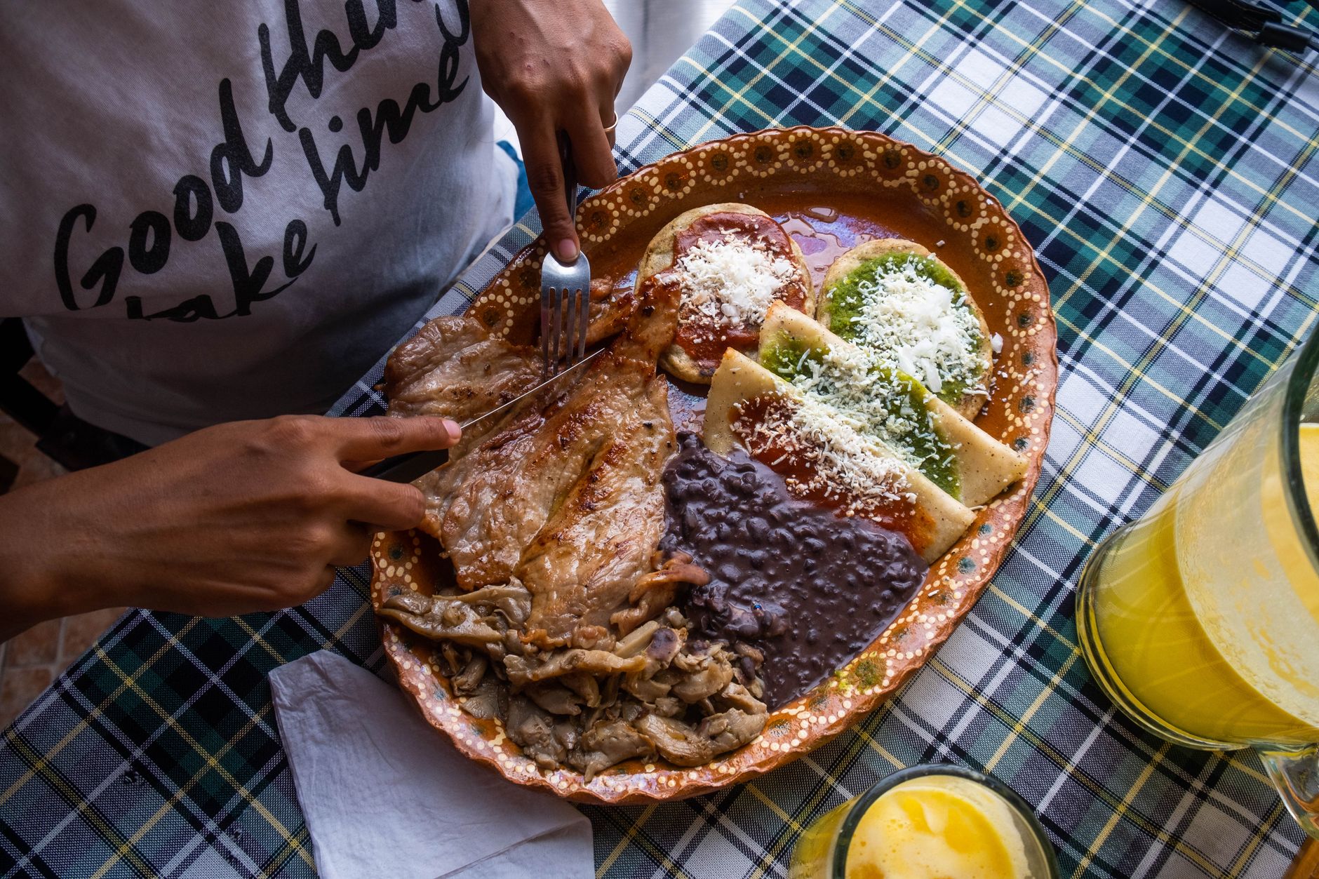 Stacked corn tortillas and cheese, ingredients for enchiladas