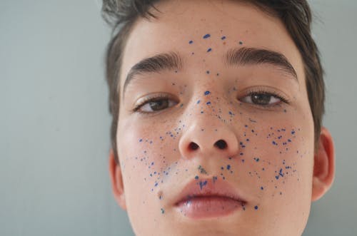 Free Close-up Photo Of Boy's Face With Paint Splatter Stock Photo