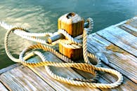 Brown Wooden Dock With Post Tied With Brown Rope