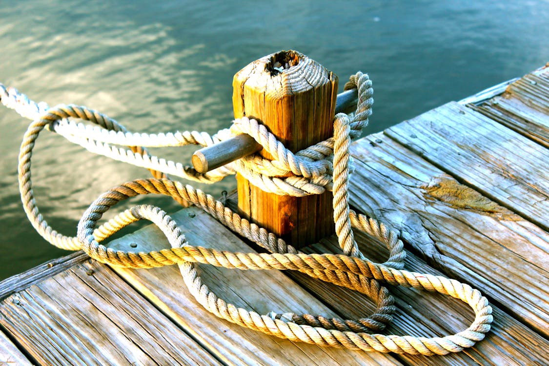 Free Brown Wooden Dock With Post Tied With Brown Rope Stock Photo