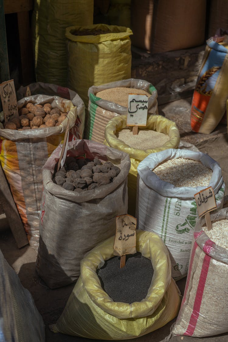 Sacks Of Rice Grains And Crops On A Stall