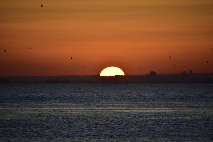 A Sun Setting Over The Sea