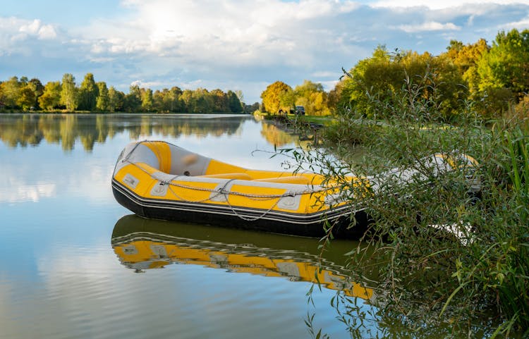 Yellow Inflatable Boat Floating On A Lake