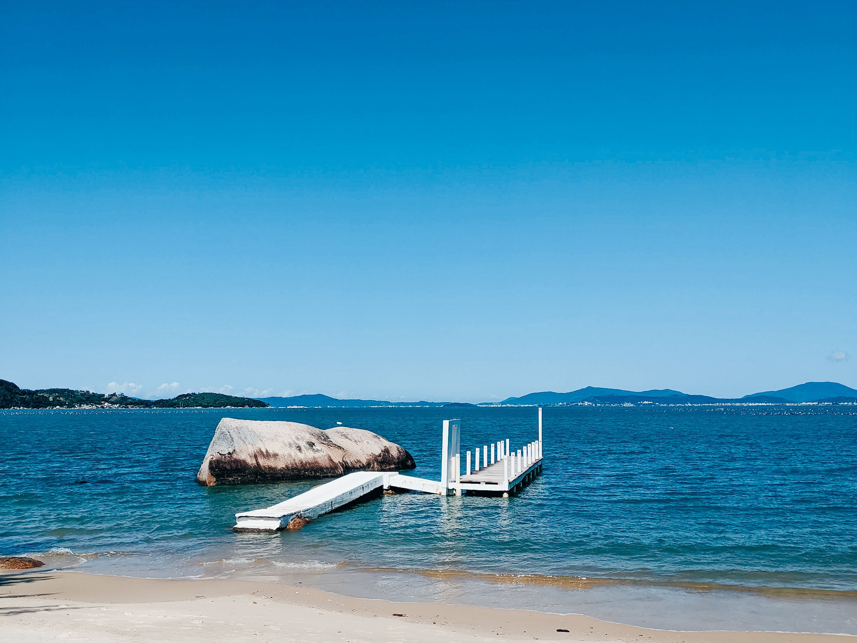 White Wooden Dock on the Sea Under Blue Sky · Free Stock Photo
