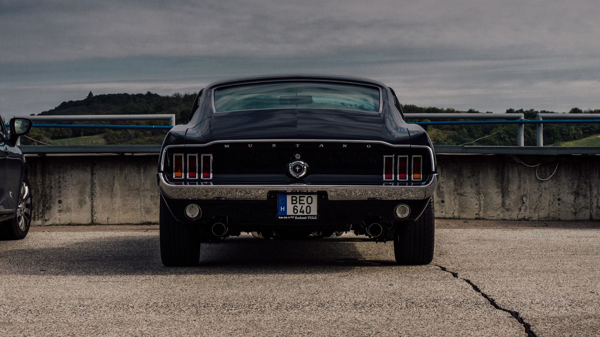 Black Ford Mustang on the Concrete Car Park